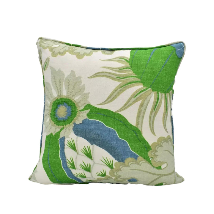 A square throw pillow with a vibrant floral pattern in shades of green and blue.