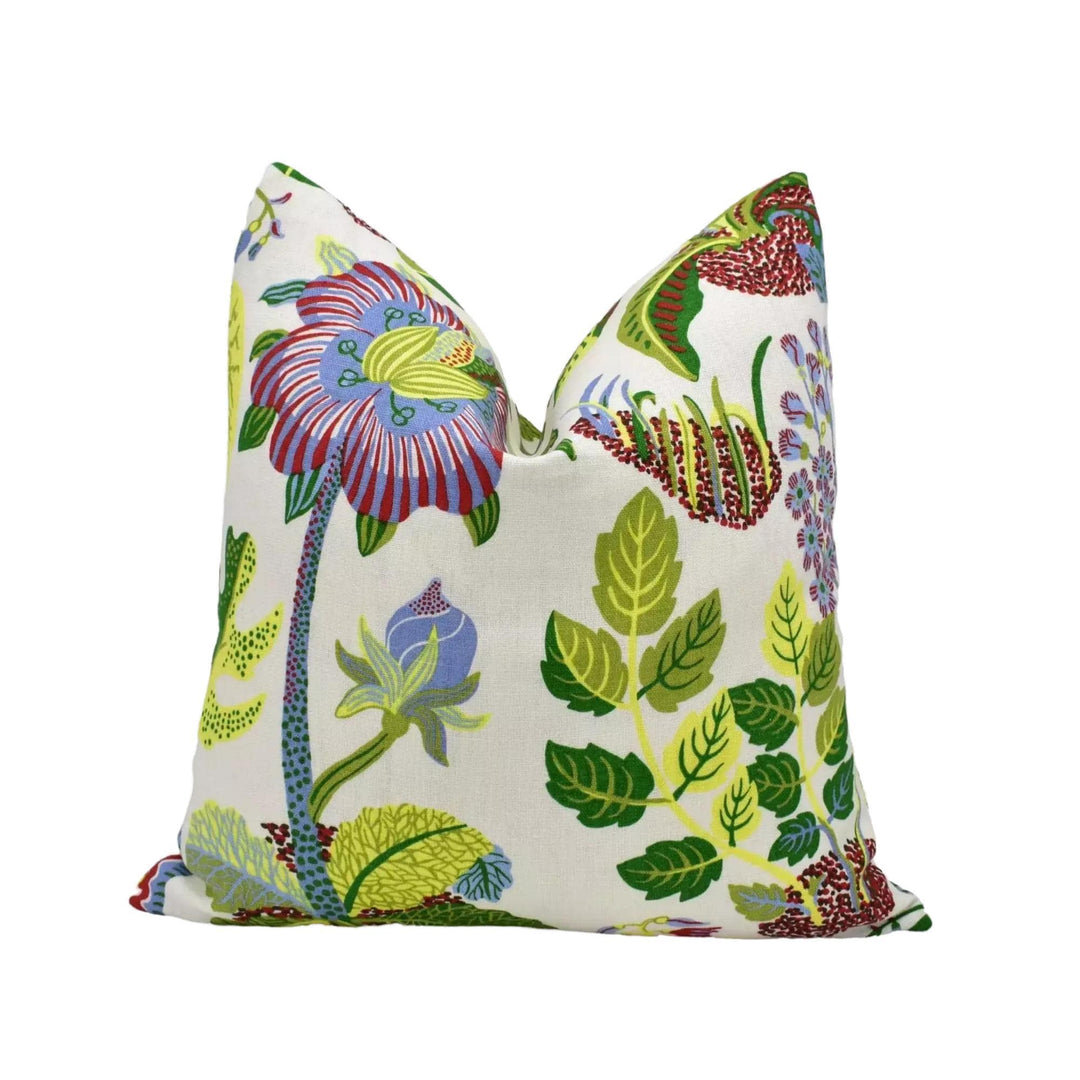 a white pillow with a vibrant, colorful floral pattern.