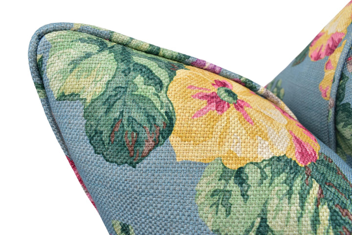 a close up of a flowered chair with a white background