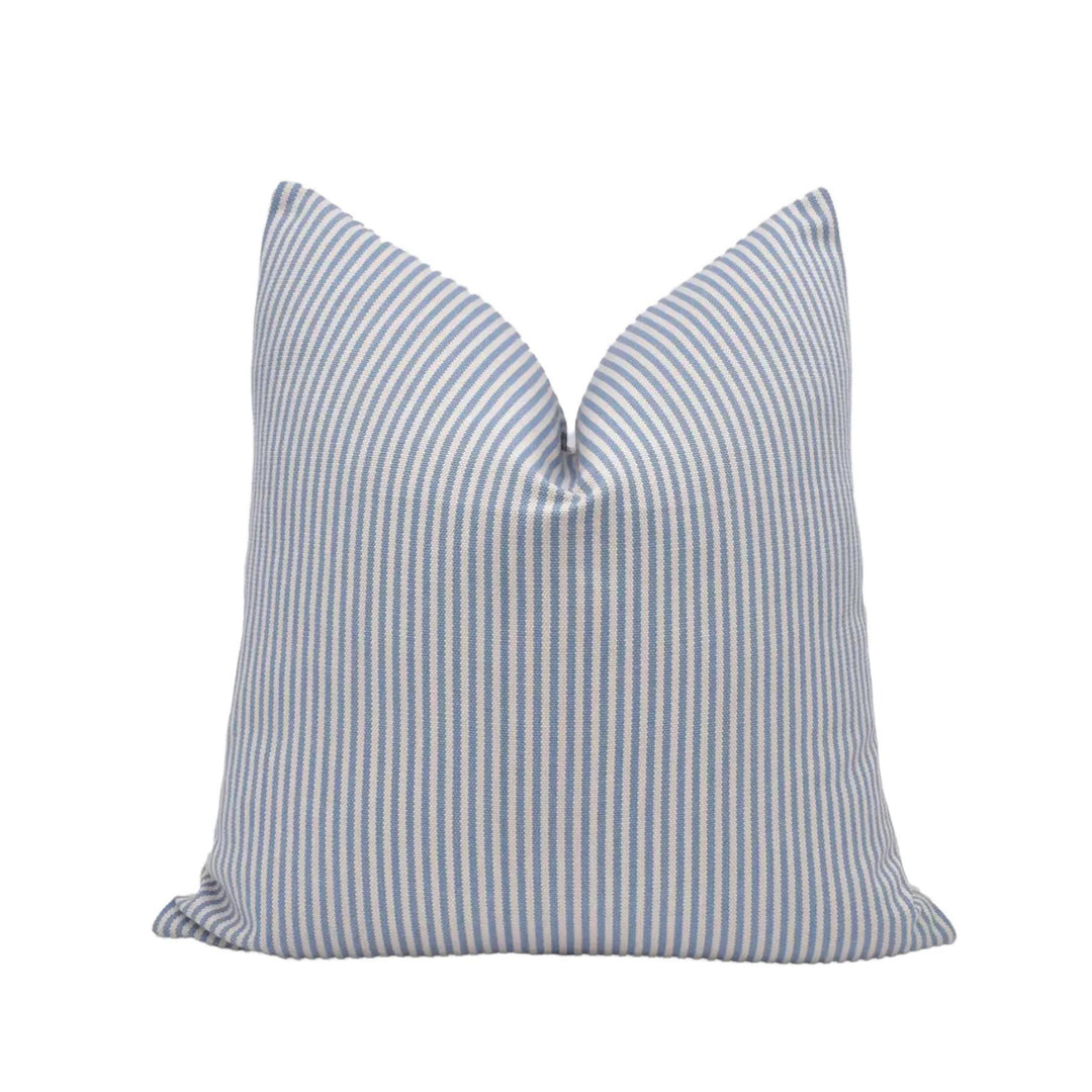 A single pillow with a striped pattern in shades of blue and white.
