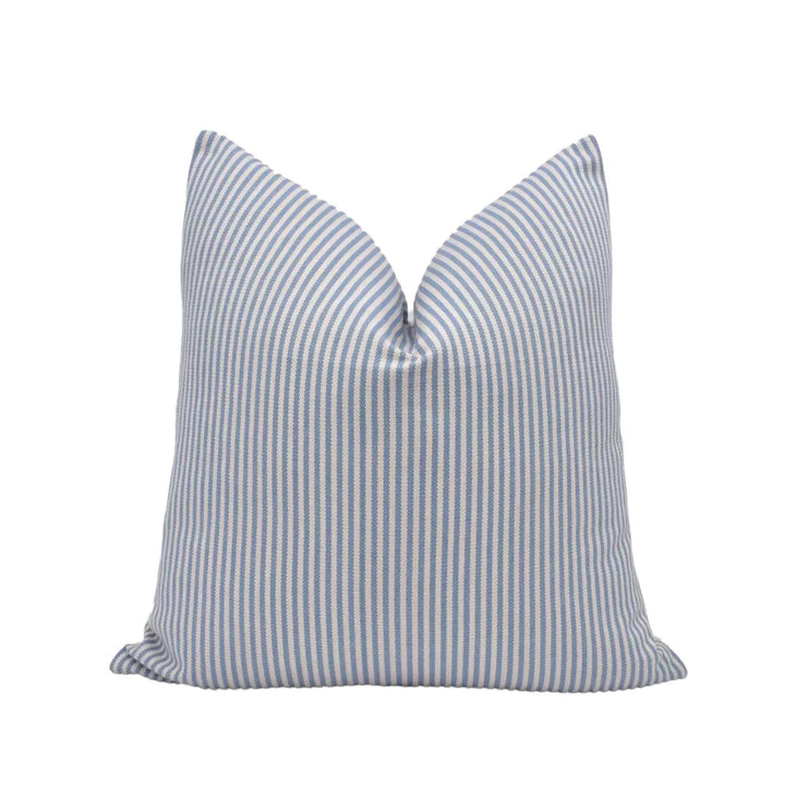 A single pillow with a striped pattern in shades of blue and white.