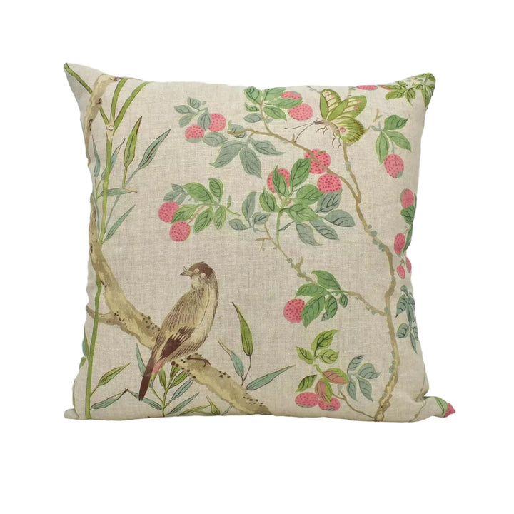 A square throw pillow with a floral print design featuring a bird perched on a branch with berries.