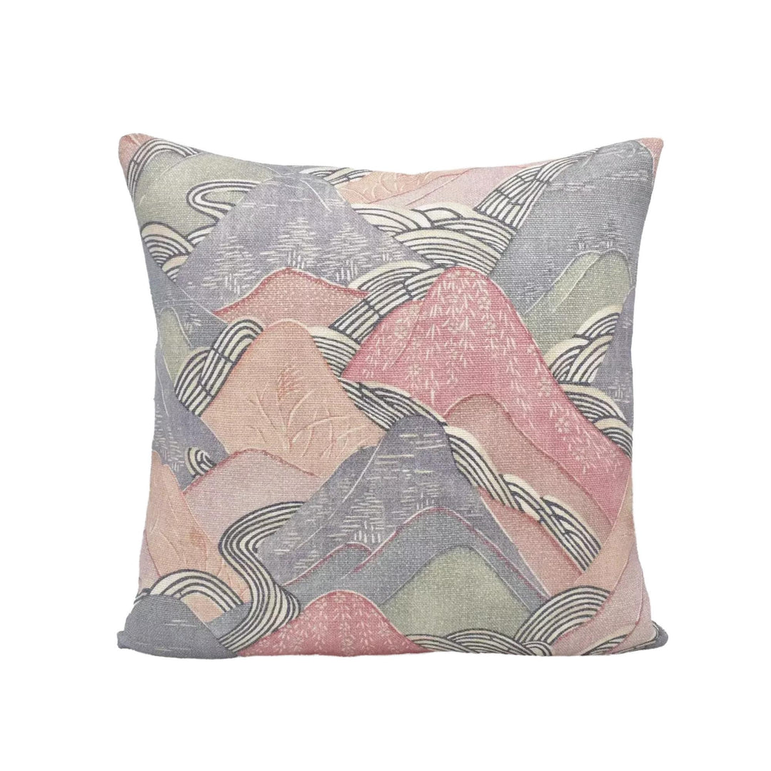 a square throw pillow with a vibrant, abstract pattern of mountains and hills in shades of pink, gray, and white.