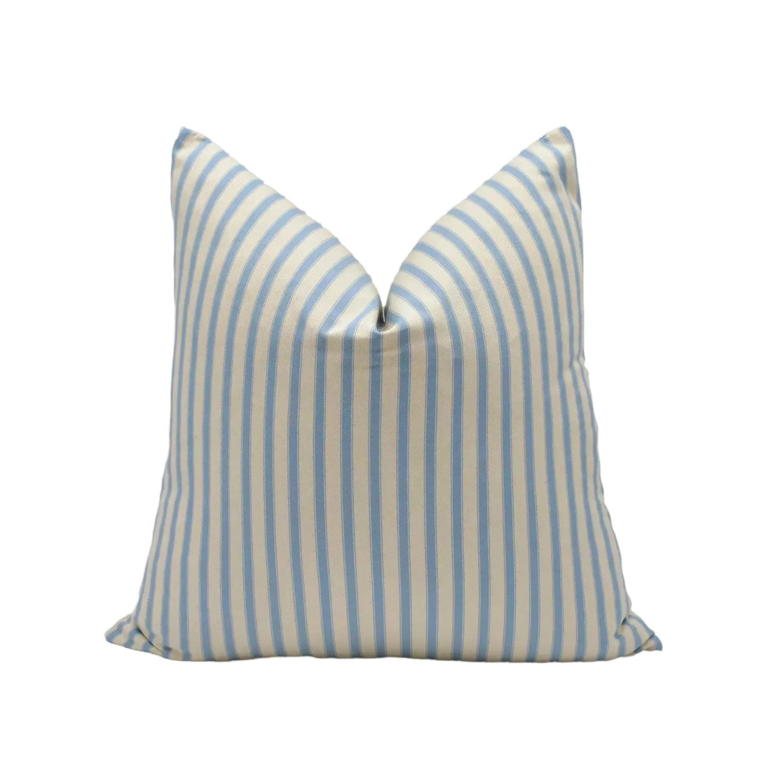 A single pillow with a striped pattern in shades of blue and white.