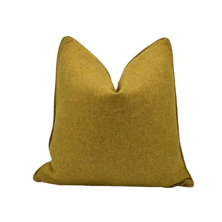 A single, solid yellow throw pillow against a white background.