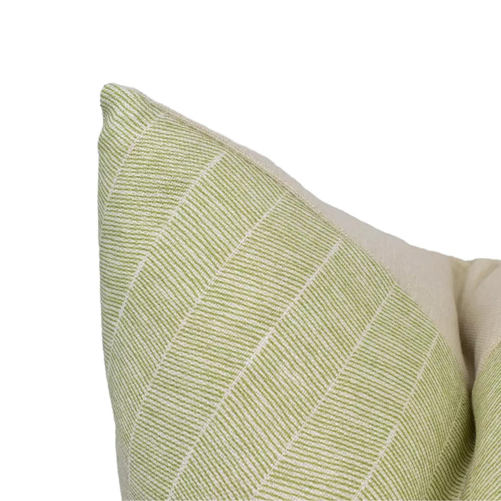 A close-up view of a green and white striped pillow against a white background.