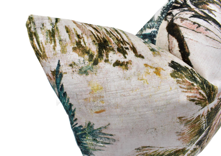 a close-up view of a decorative pillow with a tropical print design.