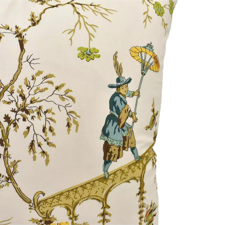 a decorative pillow with a detailed illustration of a man walking on a bridge, holding an umbrella.