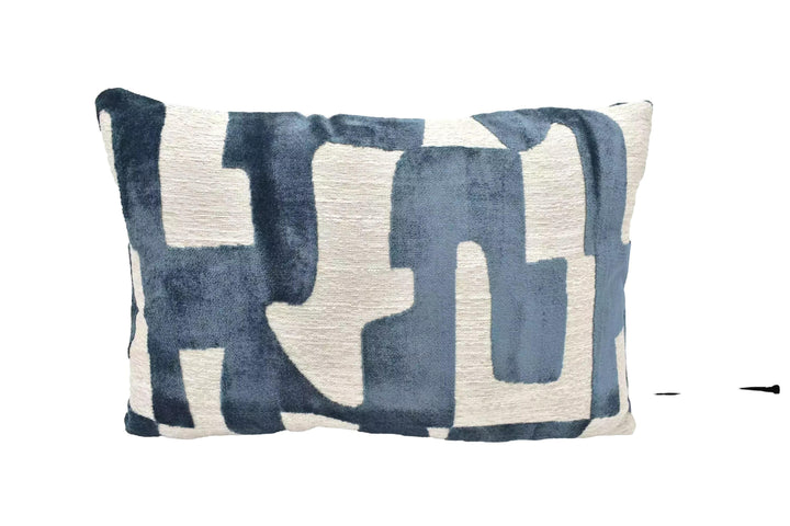 A blue and white patterned pillow is displayed against a white background.