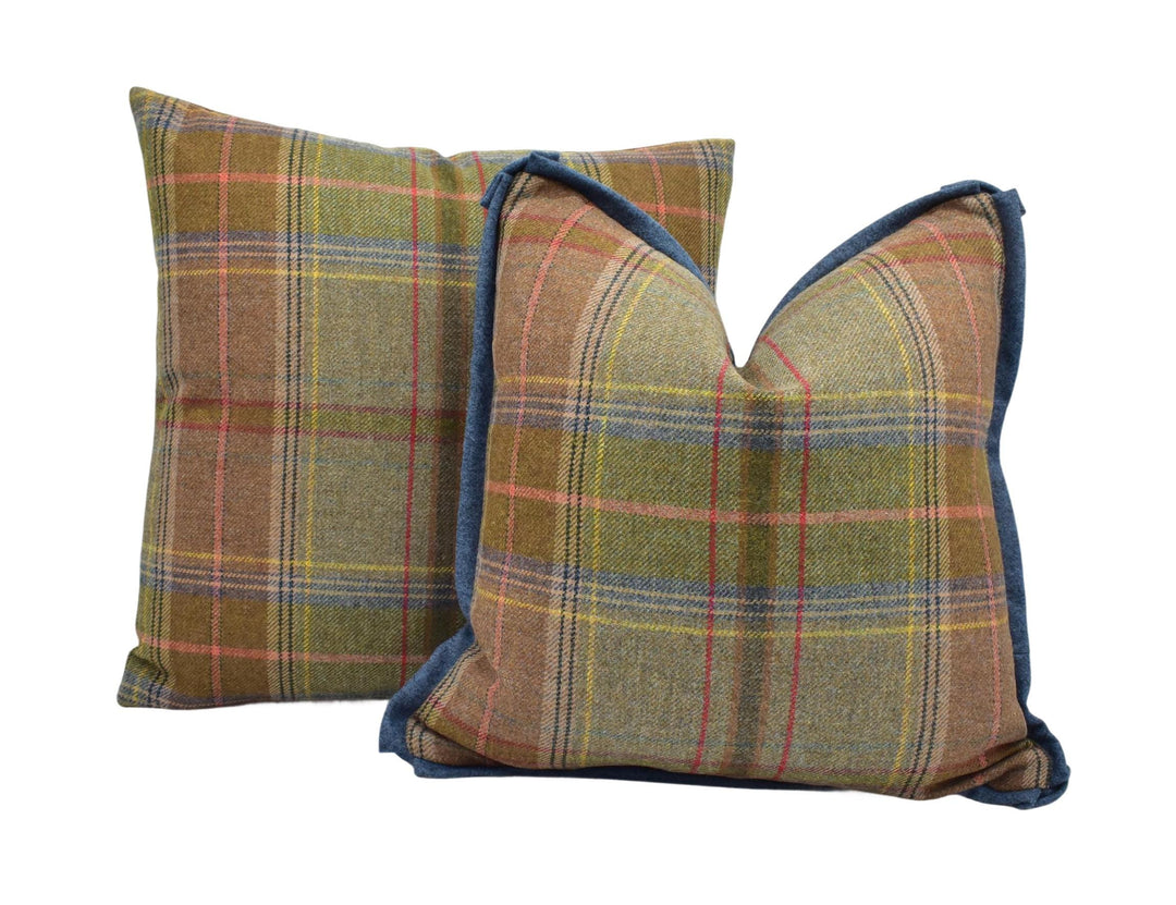 a pair of plaid pillows on a white background