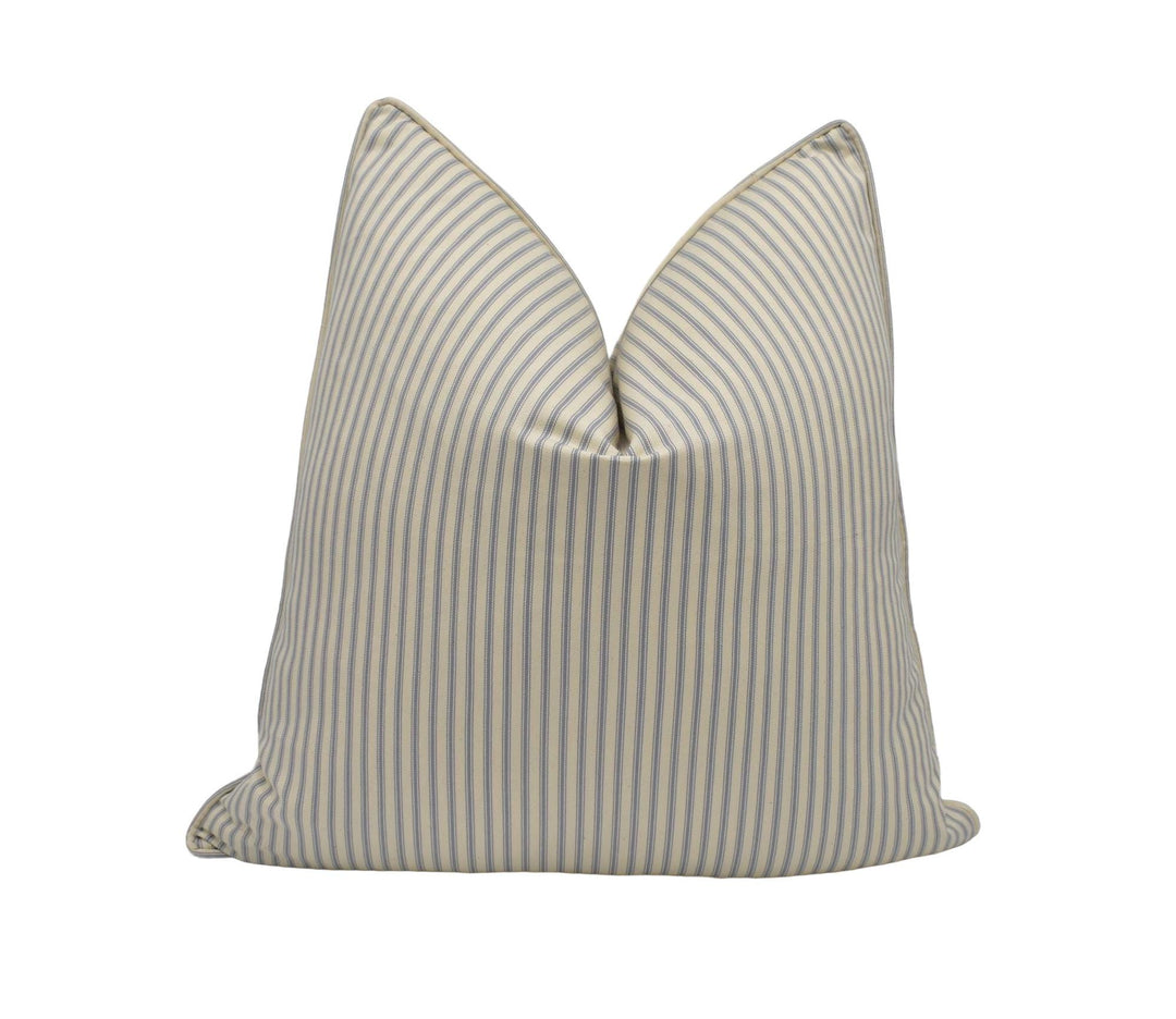 a blue and white striped pillow on a white background