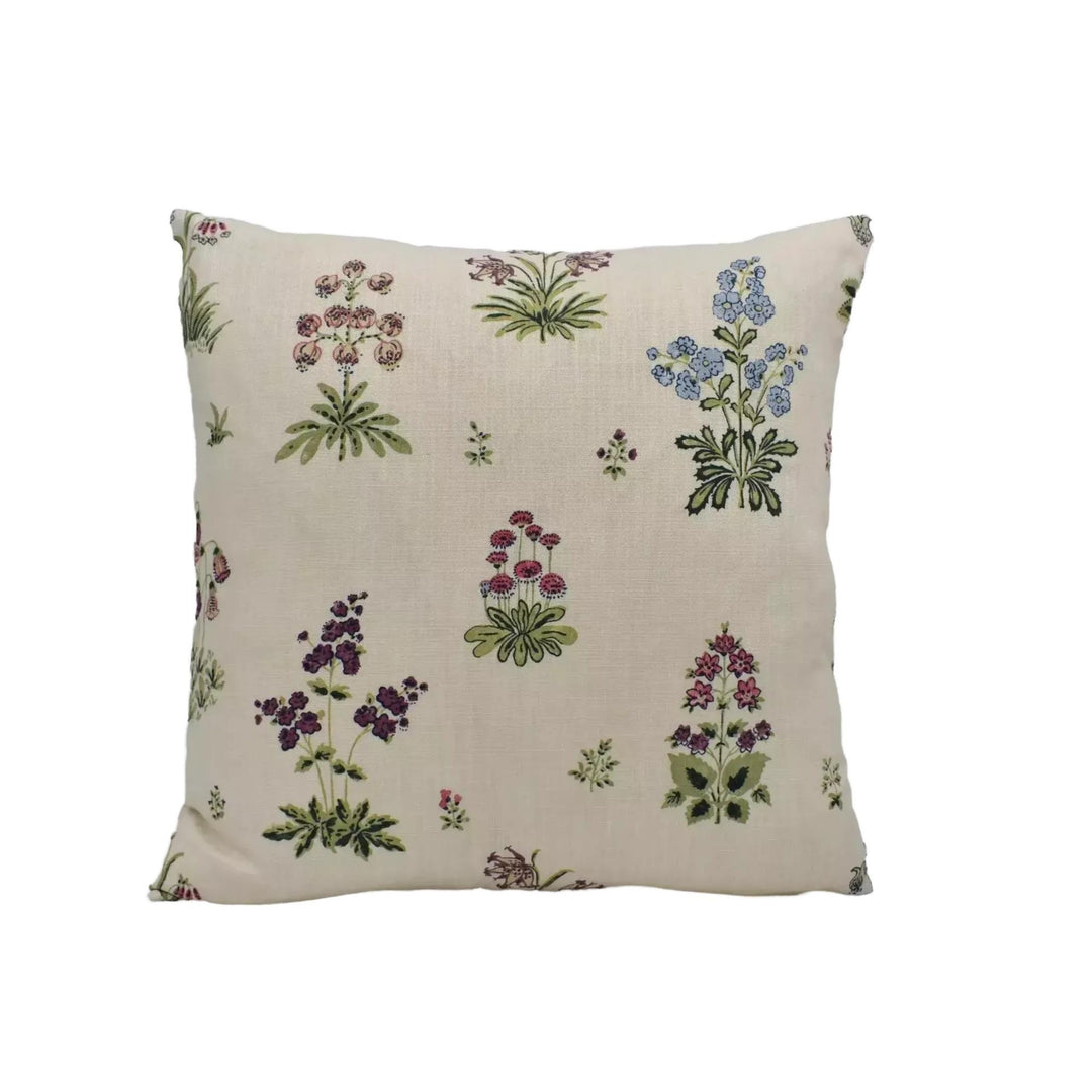 A square throw pillow with a floral print design featuring various types of flowers and plants.