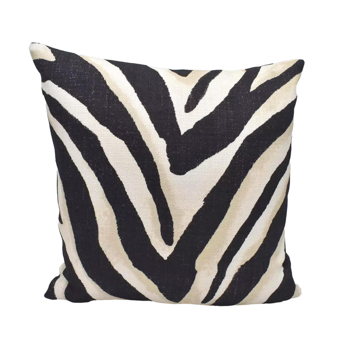 A square pillow with a zebra print design in black and white colors.