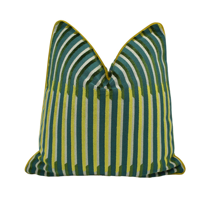 A colorful throw pillow with a striped pattern in shades of green and yellow.