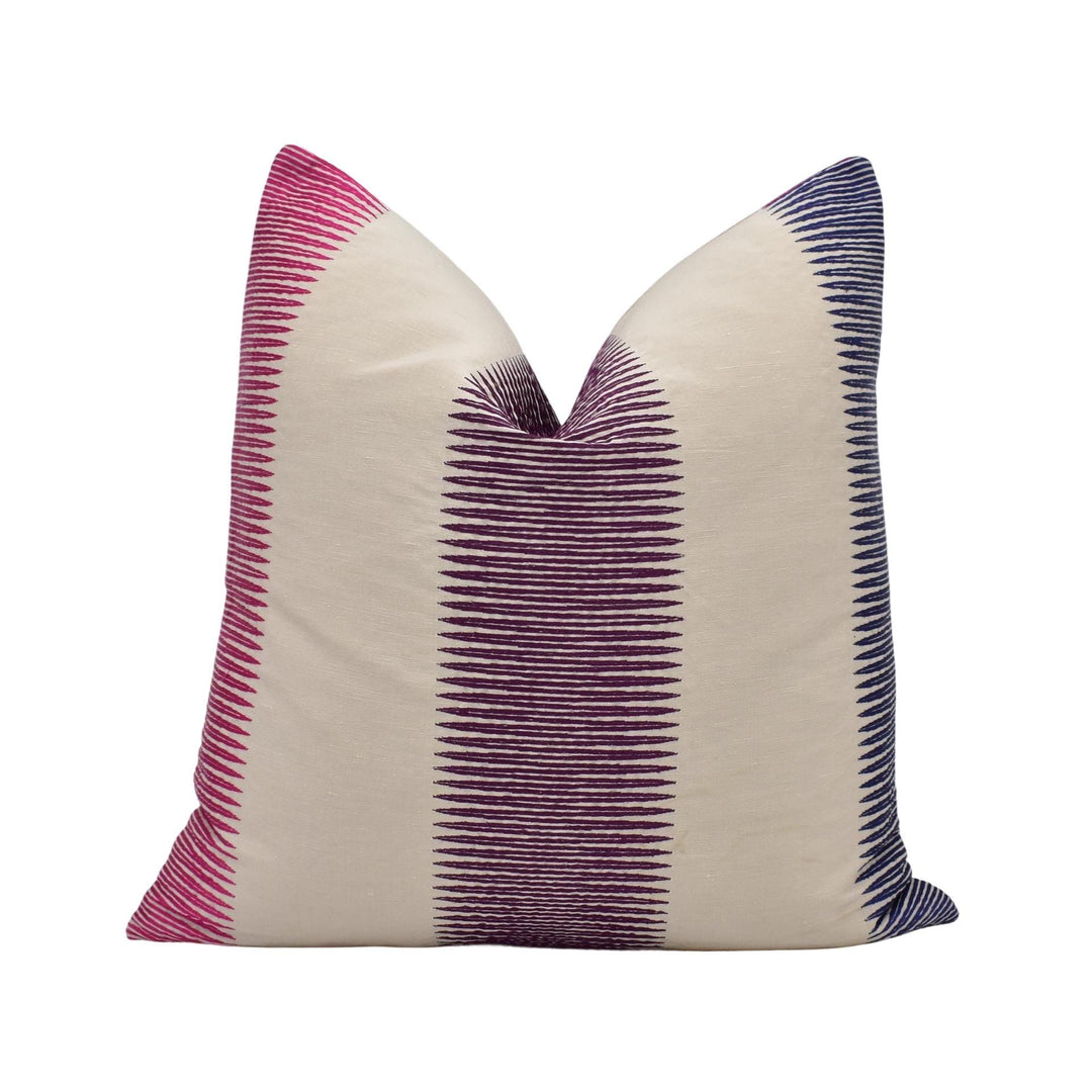 A single pillow with a striped pattern in shades of pink and blue.