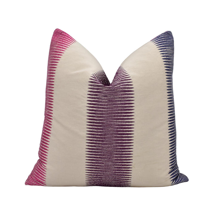 A single pillow with a striped pattern in shades of pink and blue.