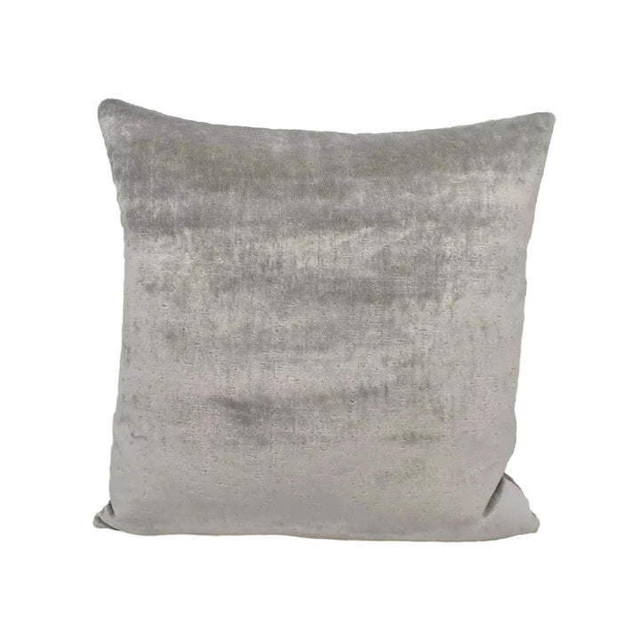 A gray velvet throw pillow is shown against a white background.