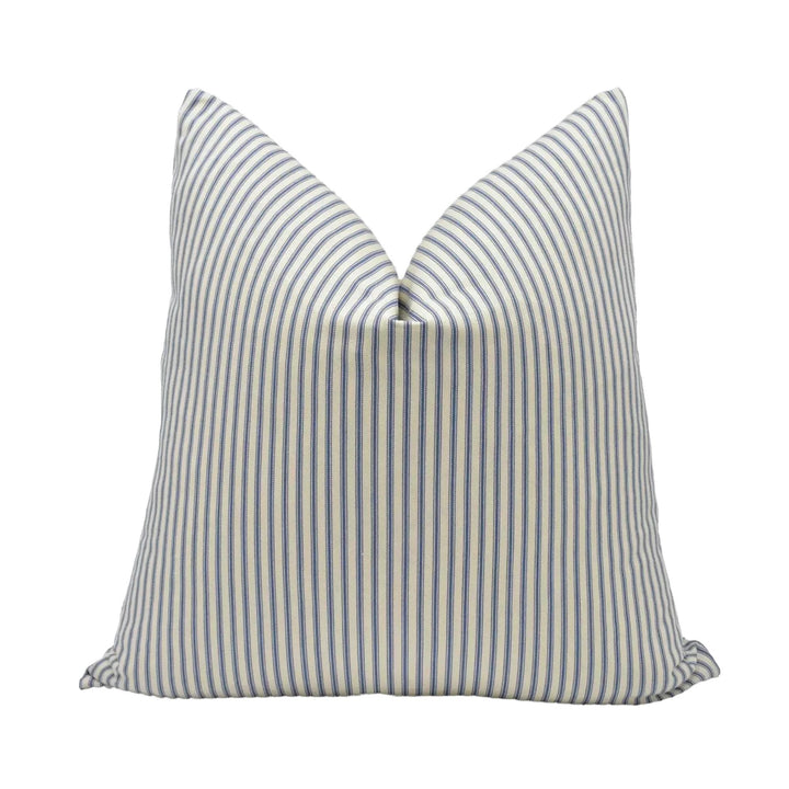 A single pillow with a striped pattern in shades of blue and white.