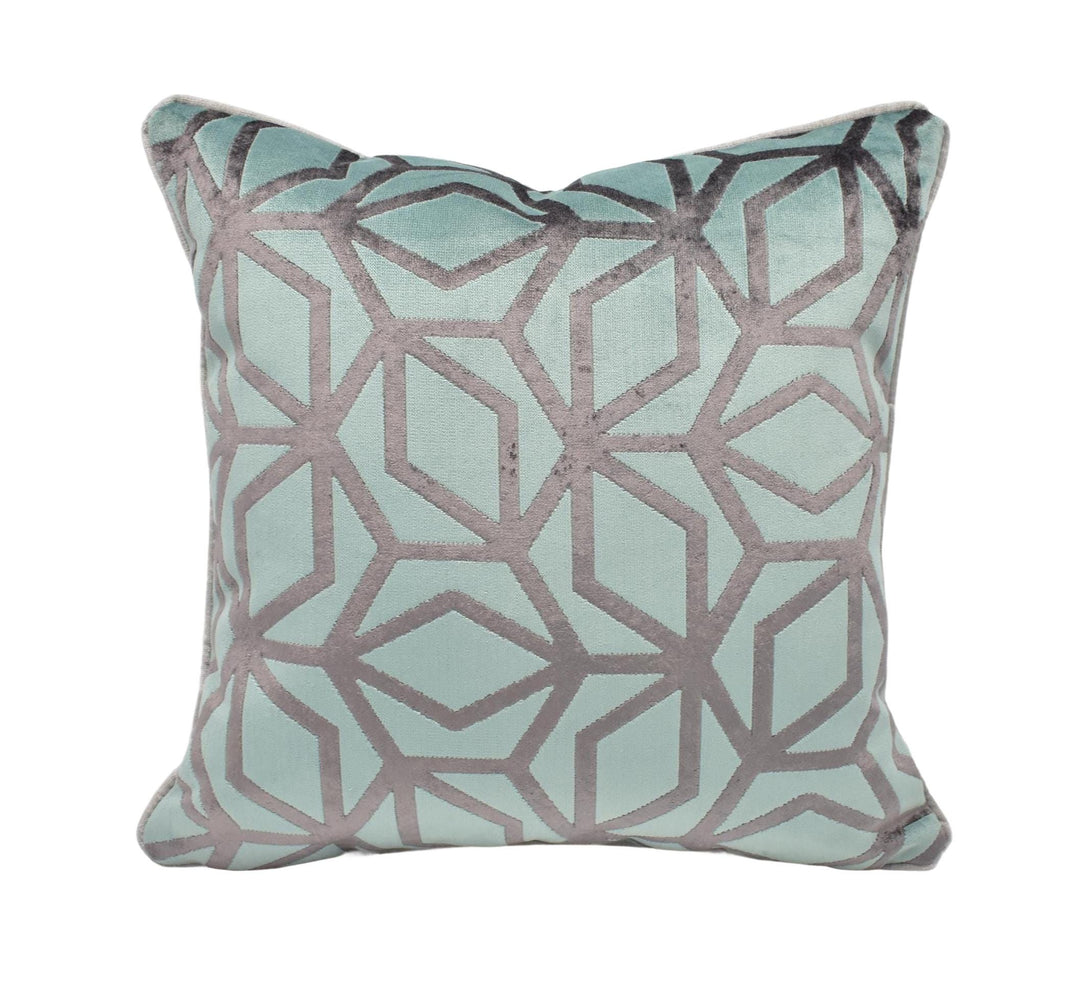 A square throw pillow with a geometric pattern in shades of blue and gray.