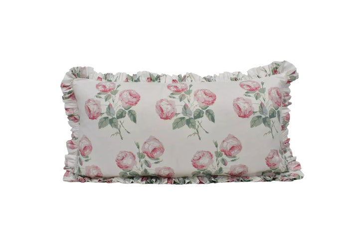 A white pillow with a floral pattern of pink roses on a white background.