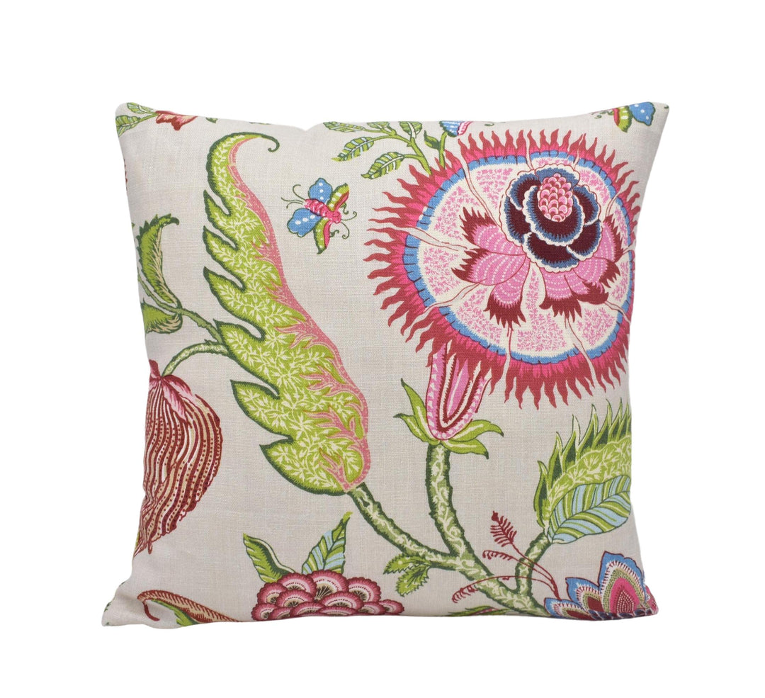 a white pillow with a colorful flower design on it
