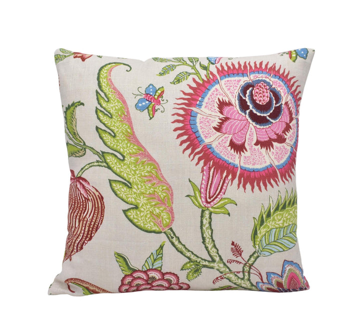 a white pillow with a colorful flower design on it