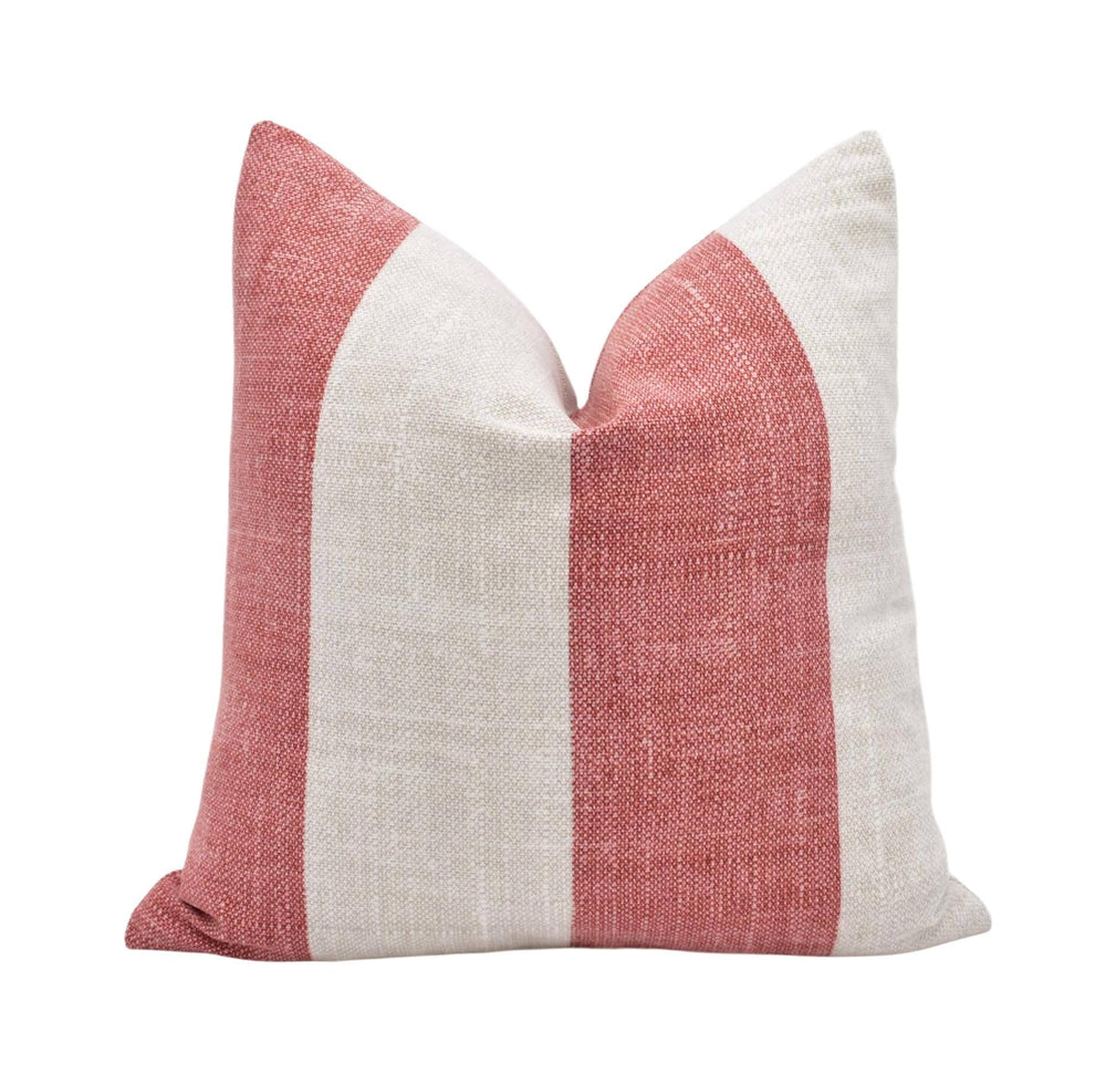 A single pillow with a striped pattern in red and white colors.