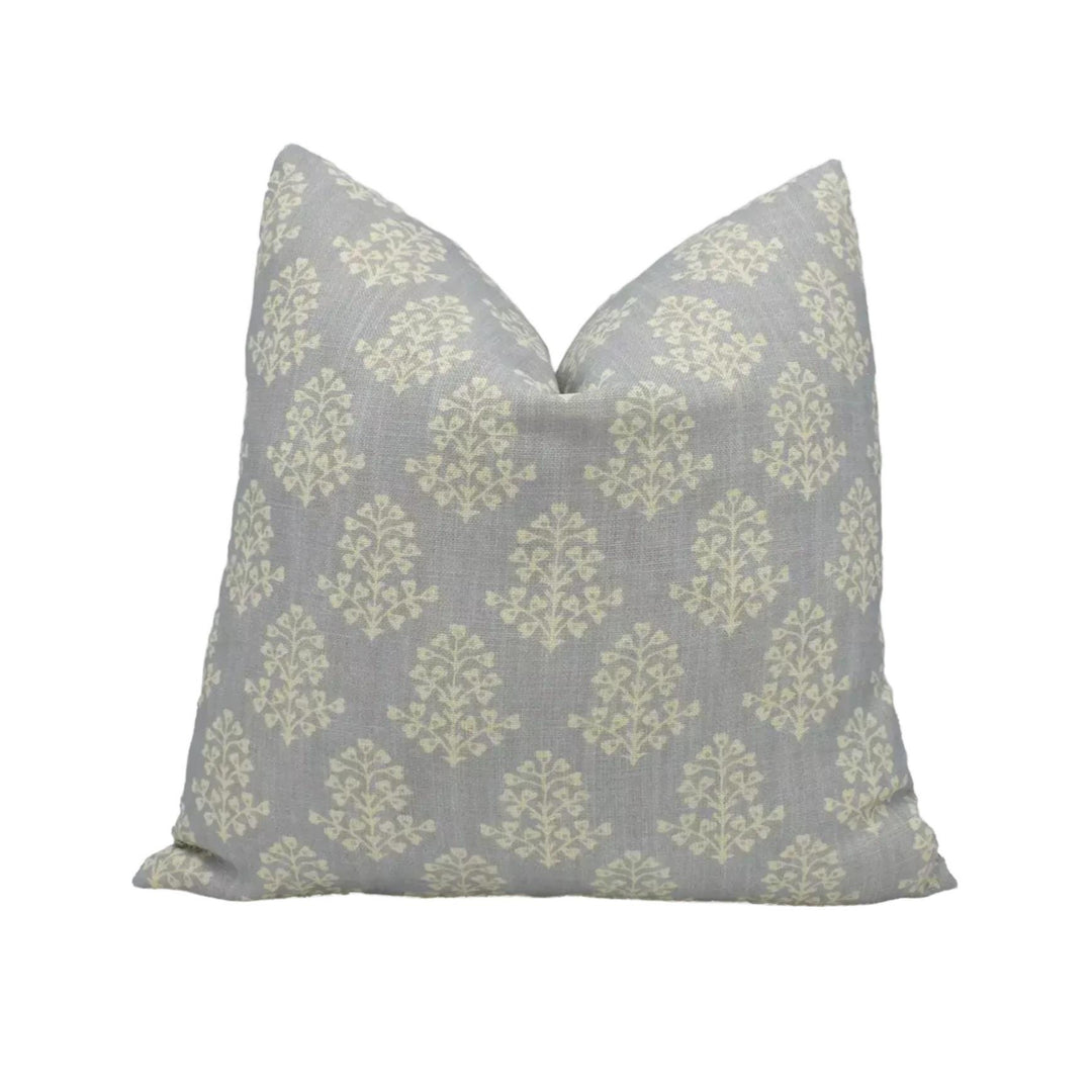 A gray and white patterned pillow is placed against a white background.
