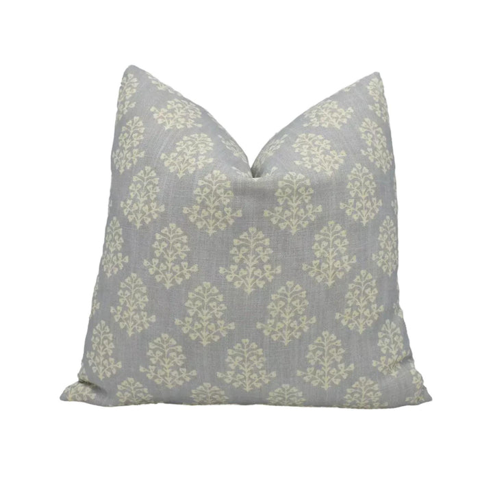 A gray and white patterned pillow is placed against a white background.