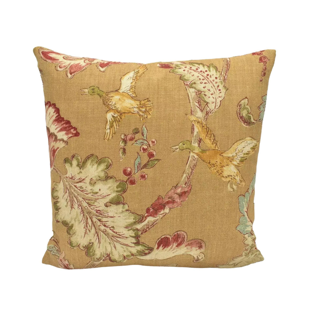 A decorative throw pillow with a floral pattern on a white background.