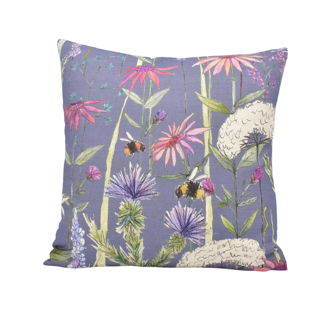 a purple pillow with flowers and bees on it