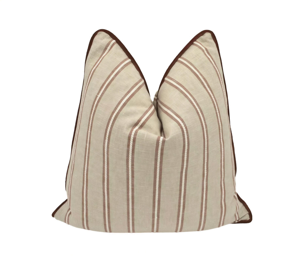 A beige and brown striped pillow with a brown border is displayed against a white background.