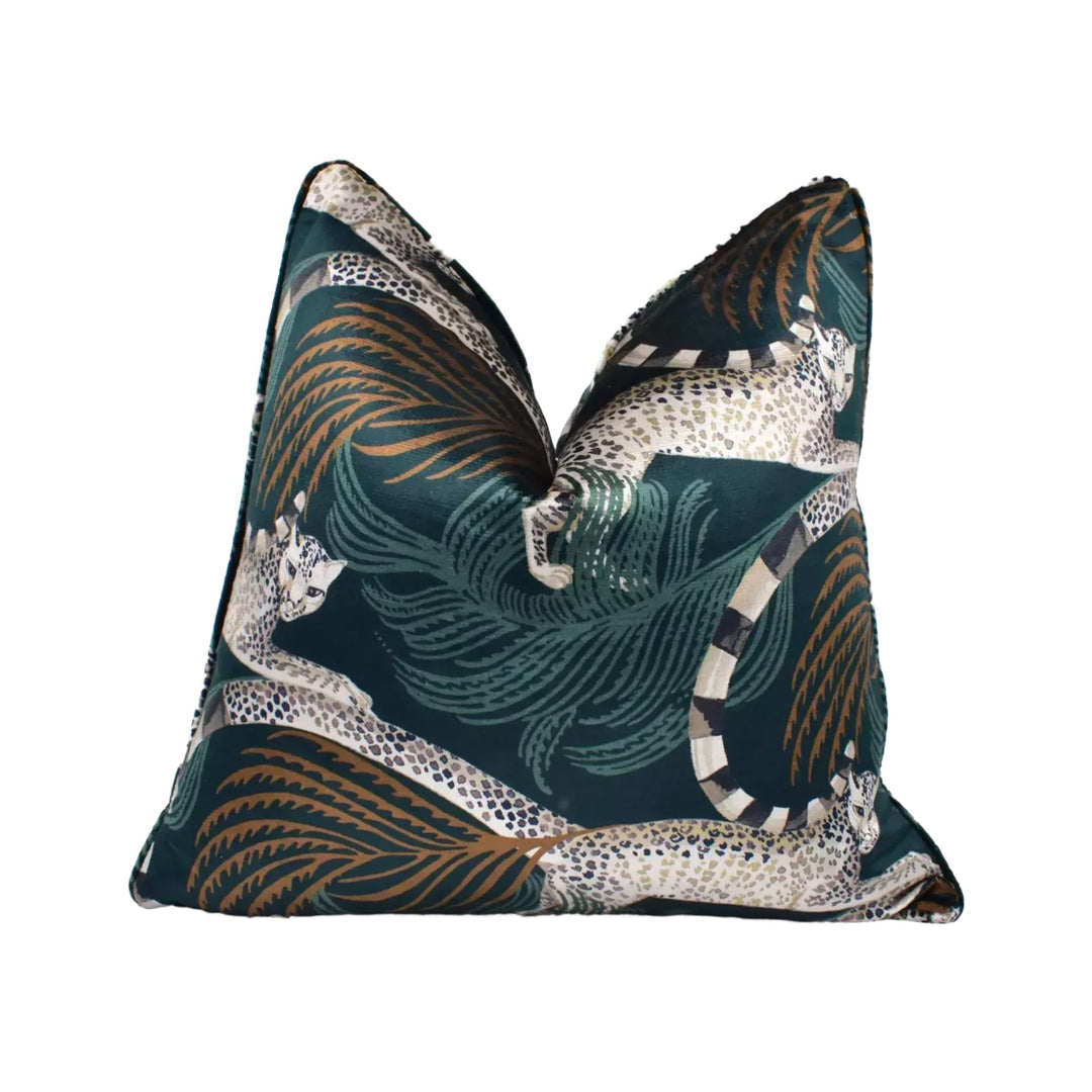 A decorative throw pillow with a leopard print design in shades of green, brown, and white.