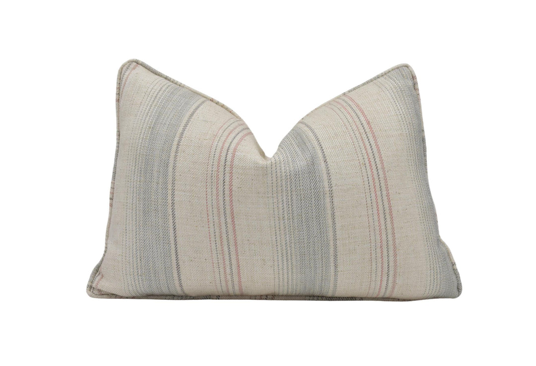 a striped pillow on a white background