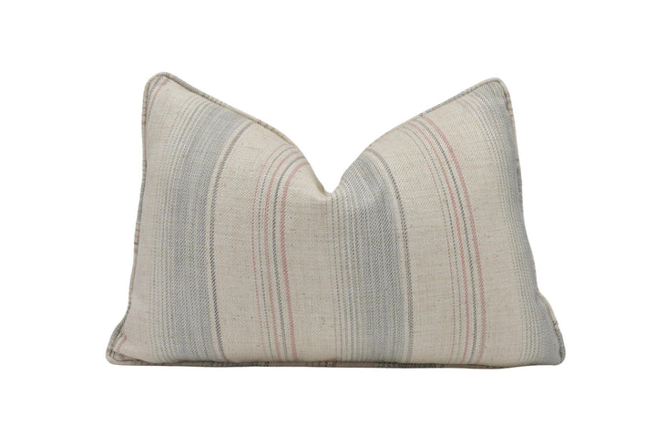 a striped pillow on a white background
