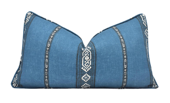 a blue pillow with a decorative design on it