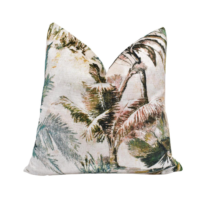 a decorative pillow with a tropical palm tree pattern.