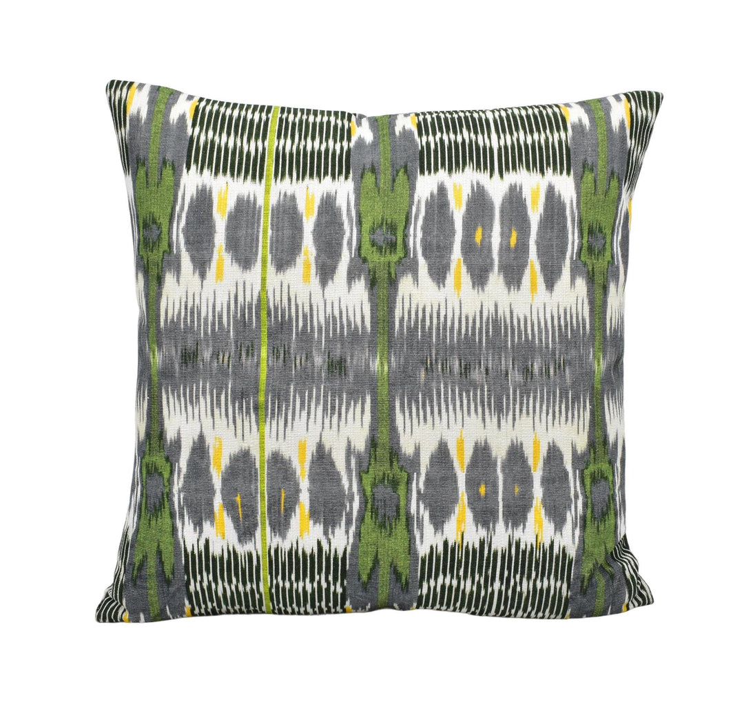 a square throw pillow with a repeating pattern of green and gray stripes and dots.