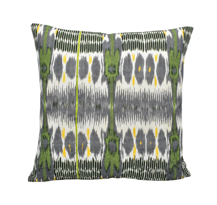 a square throw pillow with a repeating pattern of green and gray stripes and dots.