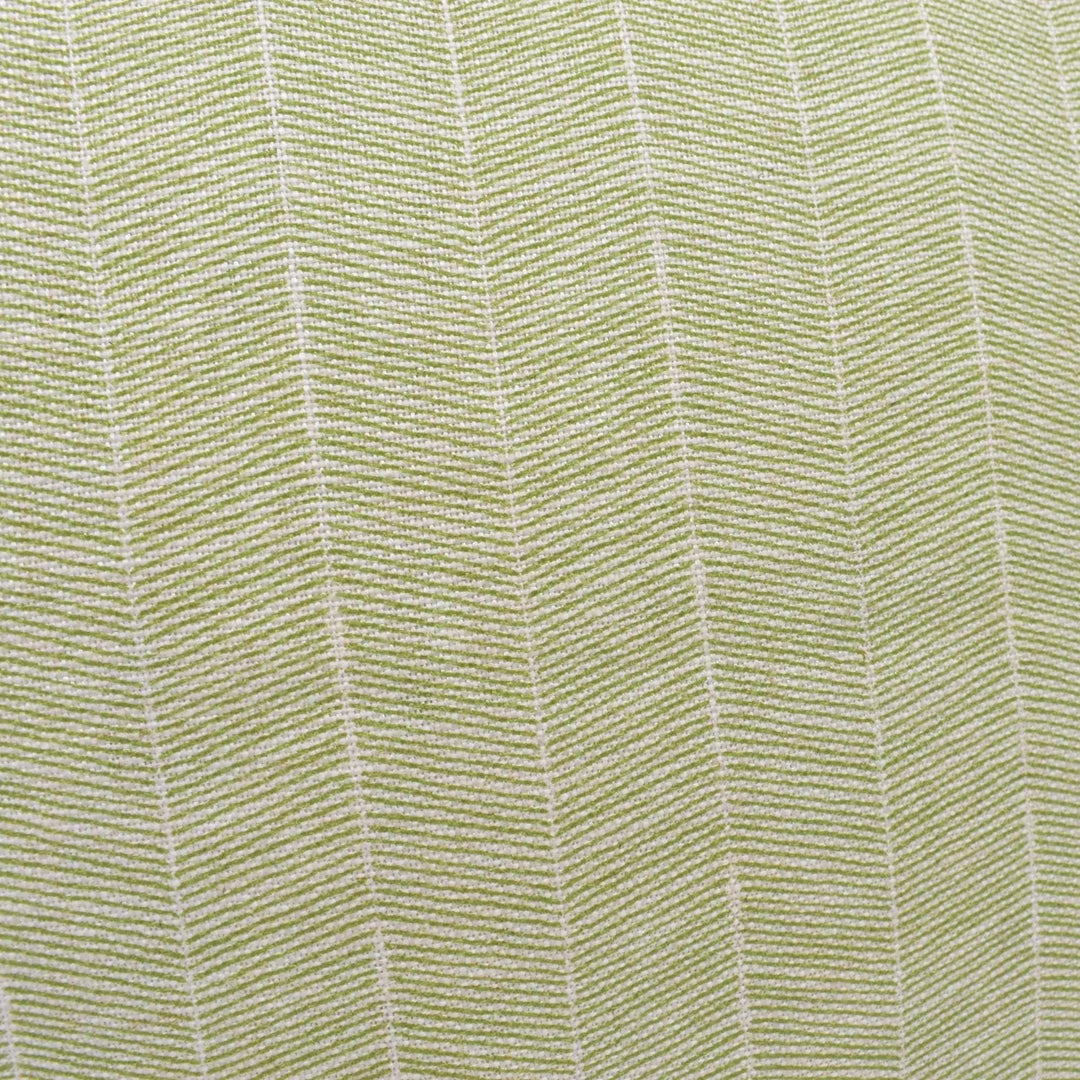 a close-up view of a fabric with a diagonal pattern of green and white stripes.