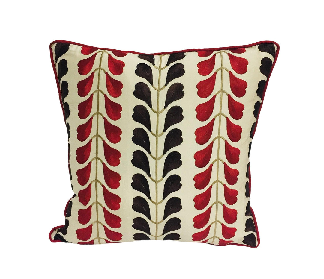 a red and black pillow on a white background
