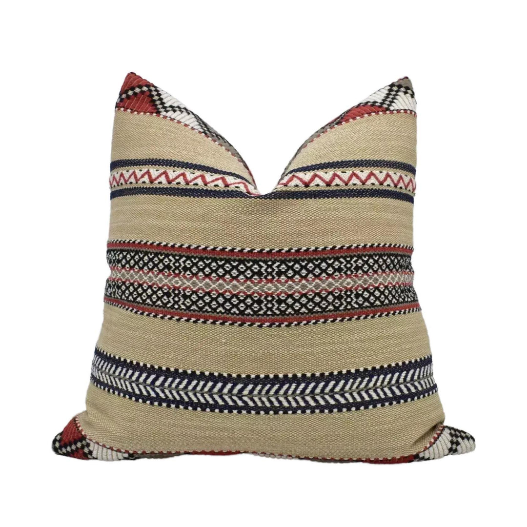 A decorative throw pillow with a striped pattern in shades of beige, red, and black.