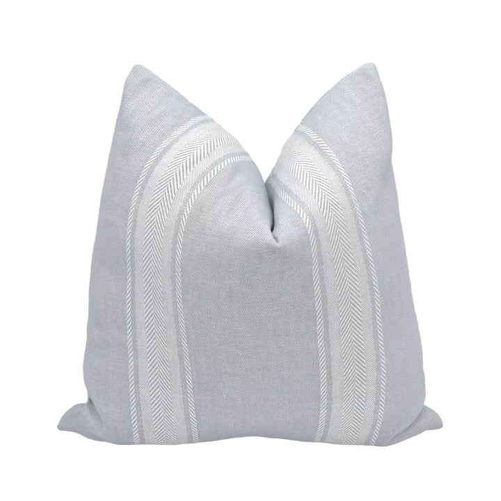 A gray and white striped pillow is displayed against a white background.