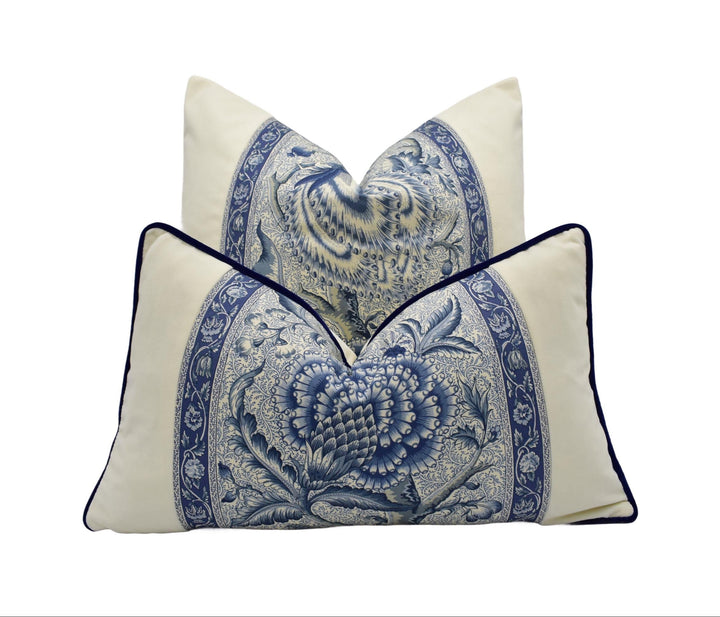 a set of decorative pillows with a blue and white floral pattern.