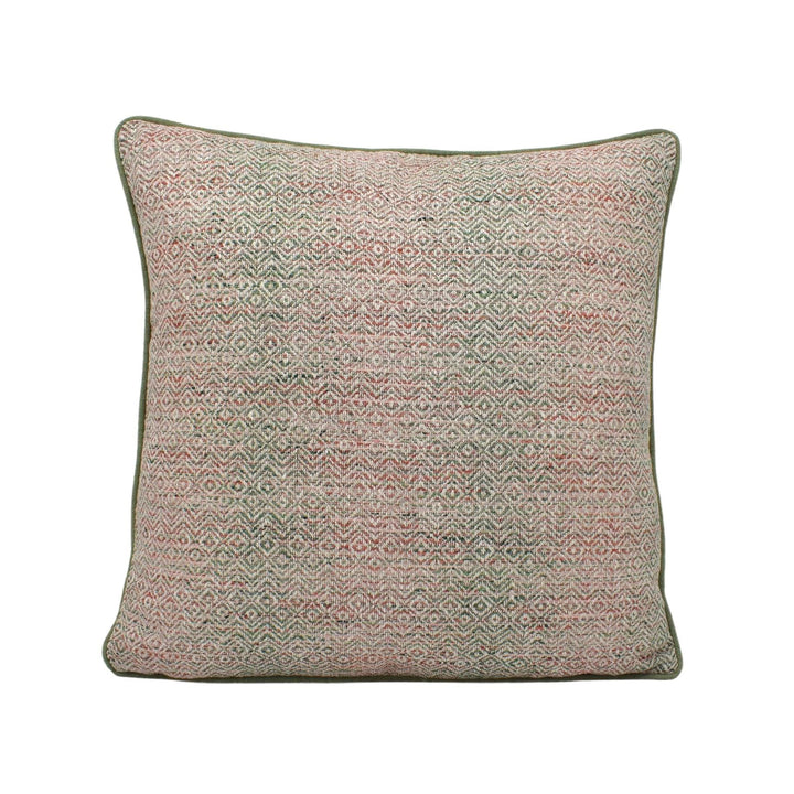 a pink and green pillow on a white background