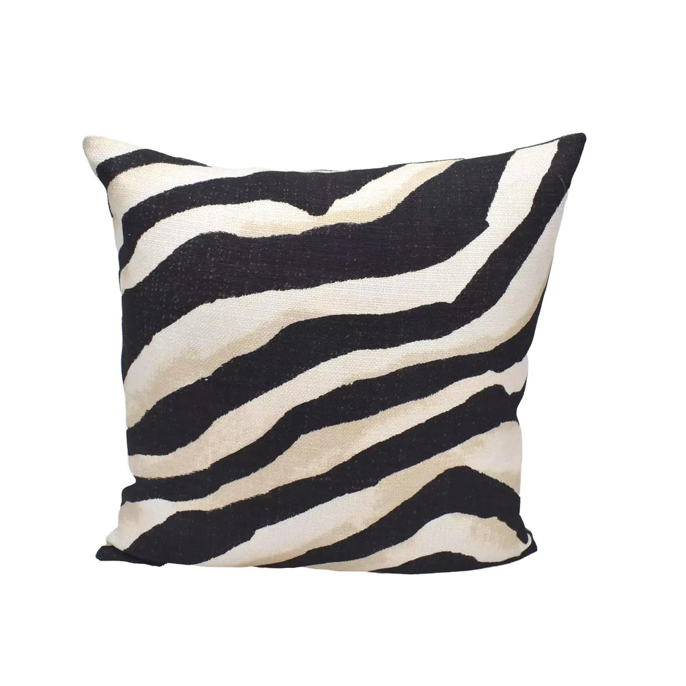 A square throw pillow with a zebra print design in black and white stripes.