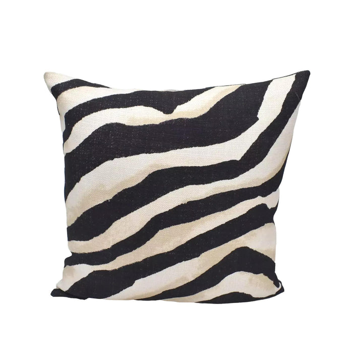 A square throw pillow with a zebra print design in black and white stripes.