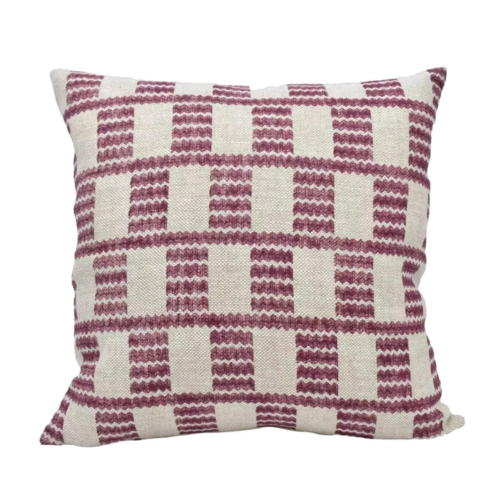 A square throw pillow with a checkered pattern in shades of pink and white.