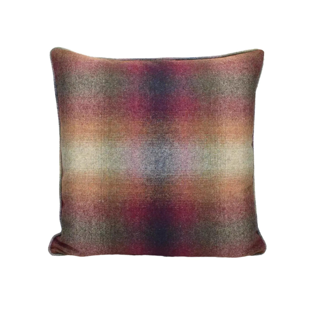 A square throw pillow with a multicolored, textured pattern in shades of red, orange, and brown.