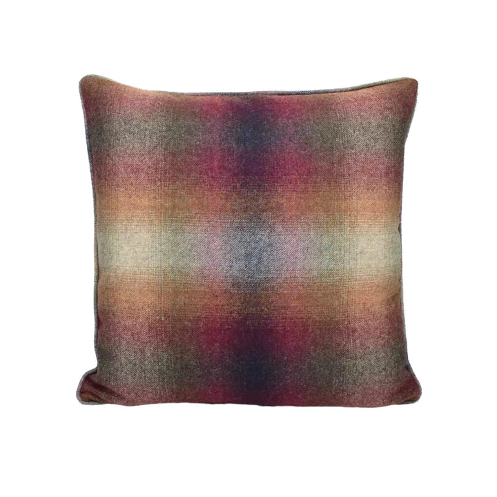 A square throw pillow with a multicolored, textured pattern in shades of red, orange, and brown.